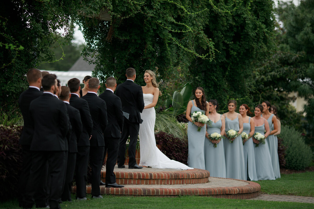 bride and groom and their wedding party during their ceremony