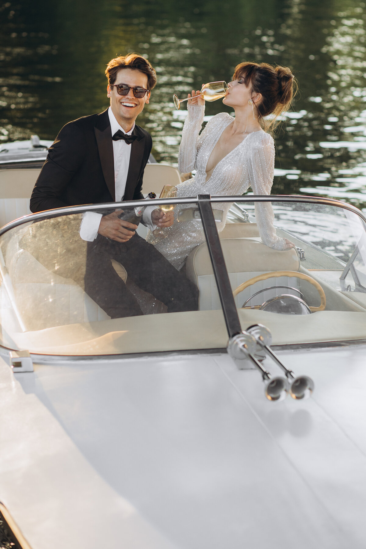 champagne on boat couple wedding