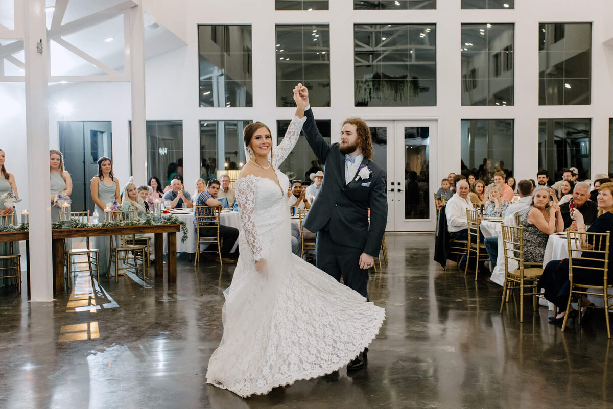 Bride and groom's 1st dance in reception hall at Four Fifteen Estates in New Boston, TX