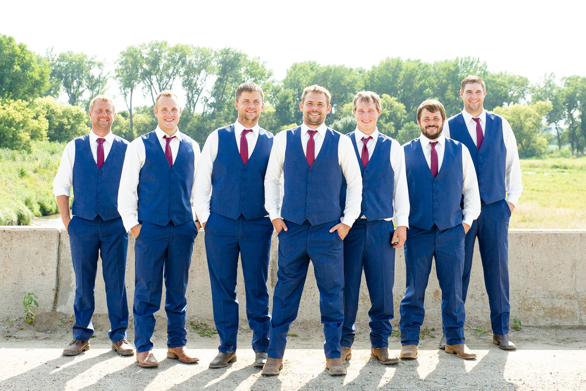 Groom with his groomsmen after the wedding