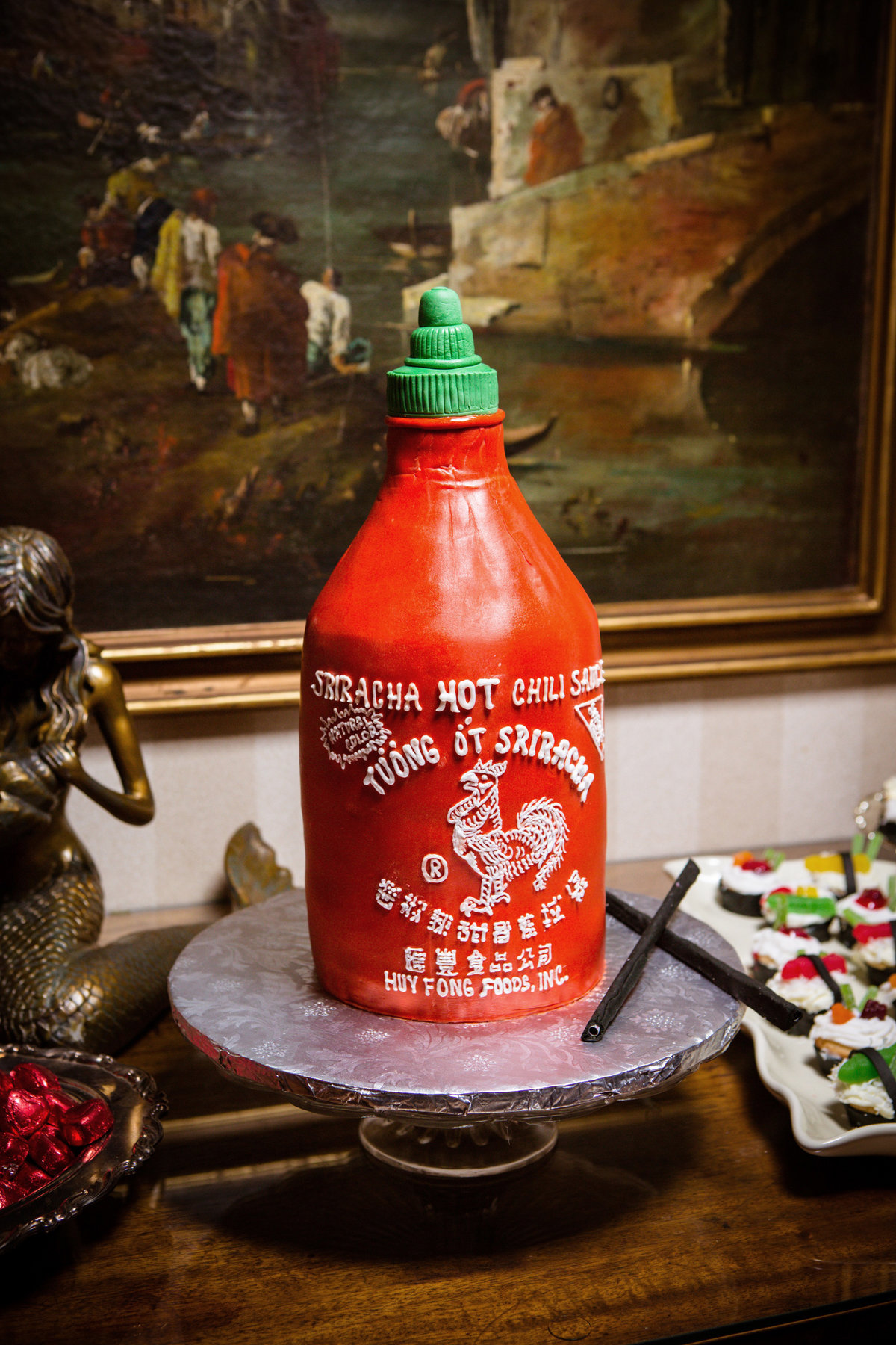 A Sriracha bottle grooms cake at the wedding reception in Mobile, Alabama.