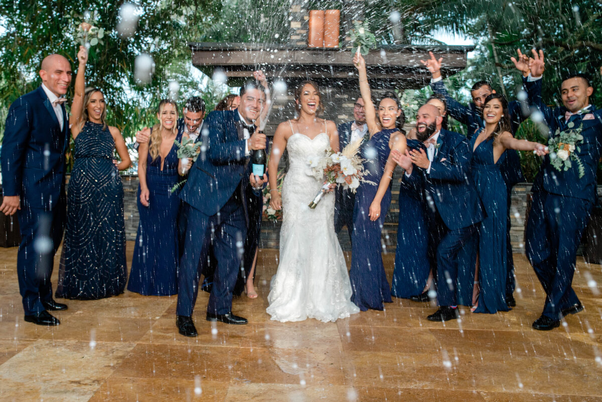 Bridal Party popping champagne photos