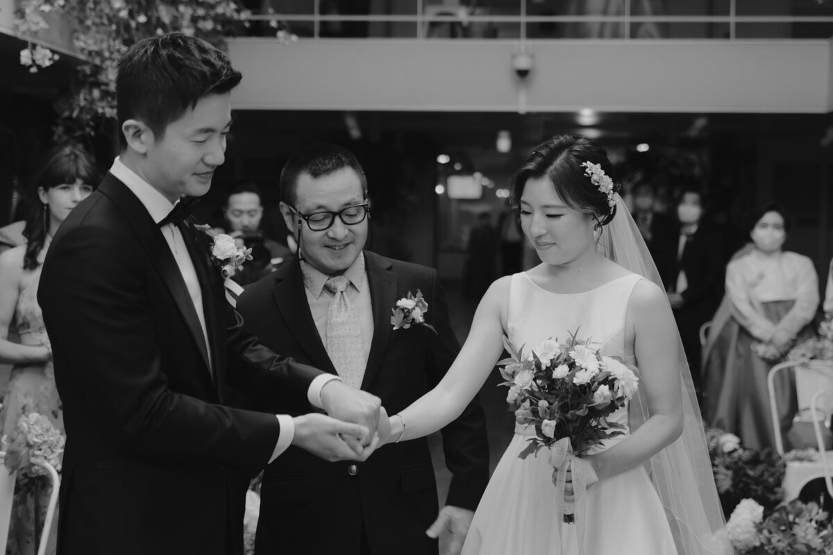 the father giving the bride's hands to the groom