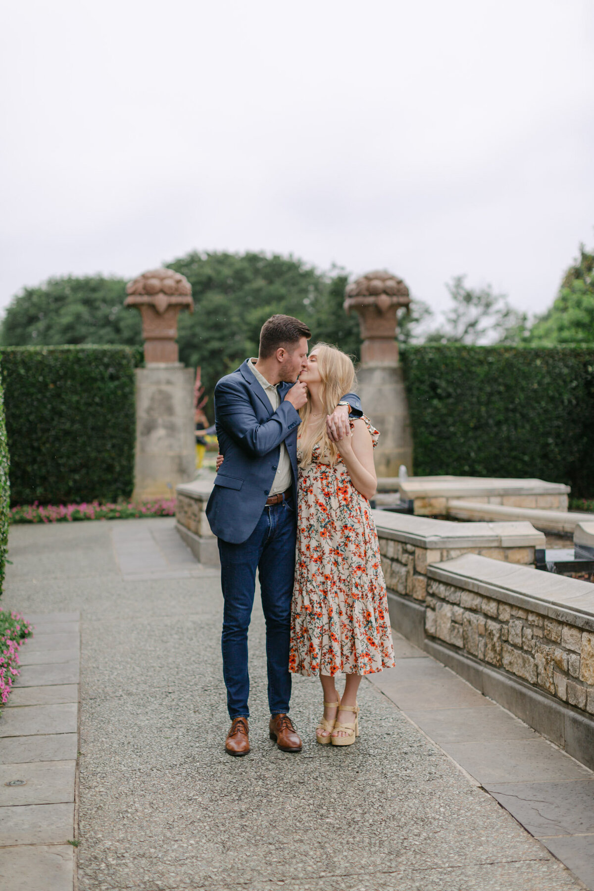 happy couple kissing during engagement photoshoot