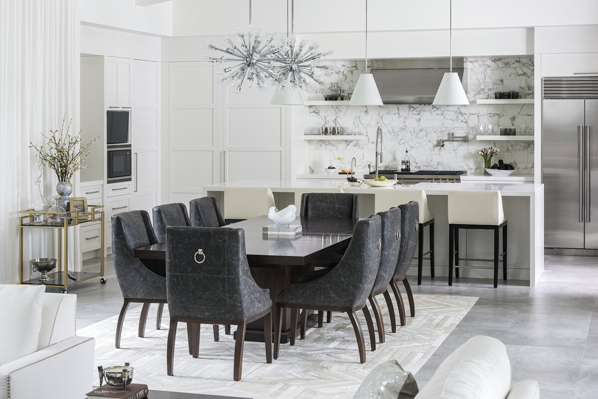 Modern White Open Kitchen With Black Fabric Dining Seats + Table