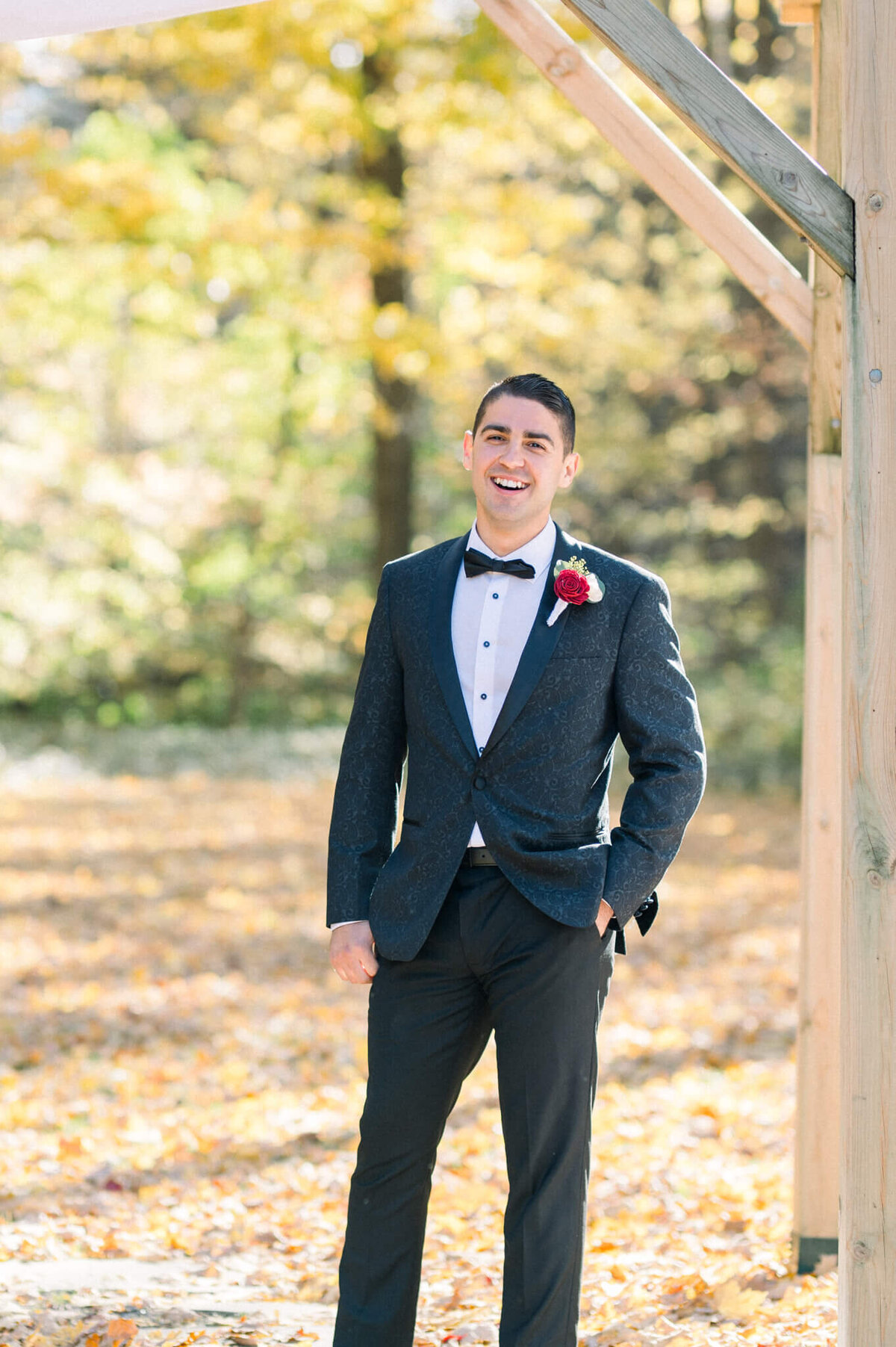 Groom with big smile on his face seeing his bride for the first time coming down the aisle