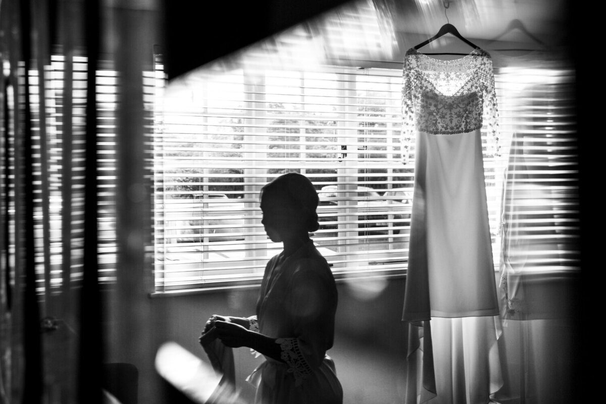 silhouette of bride and her wedding dress