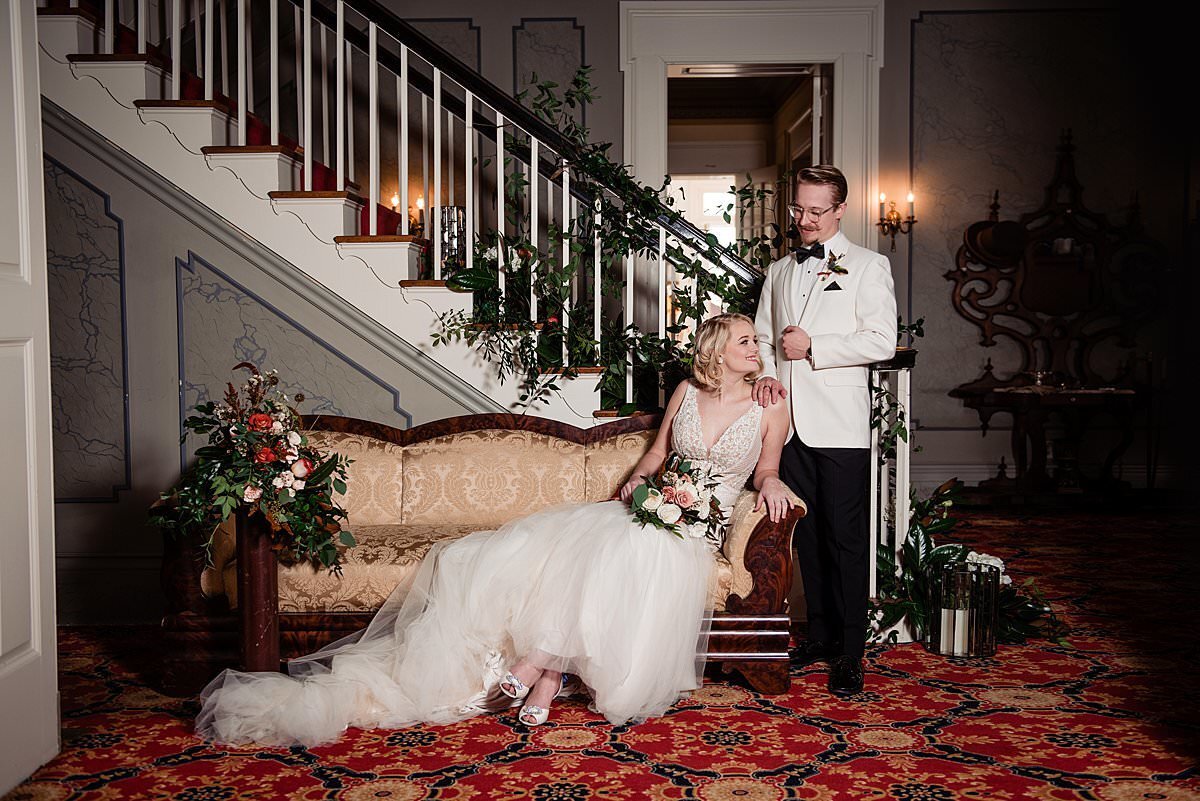 1920s themed wedding  with bride and groom on couch at Rippavilla Plantation