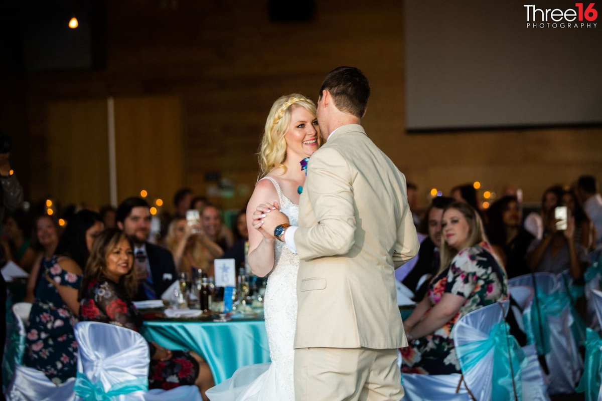 Bride and Groom's First Dance as guests watch
