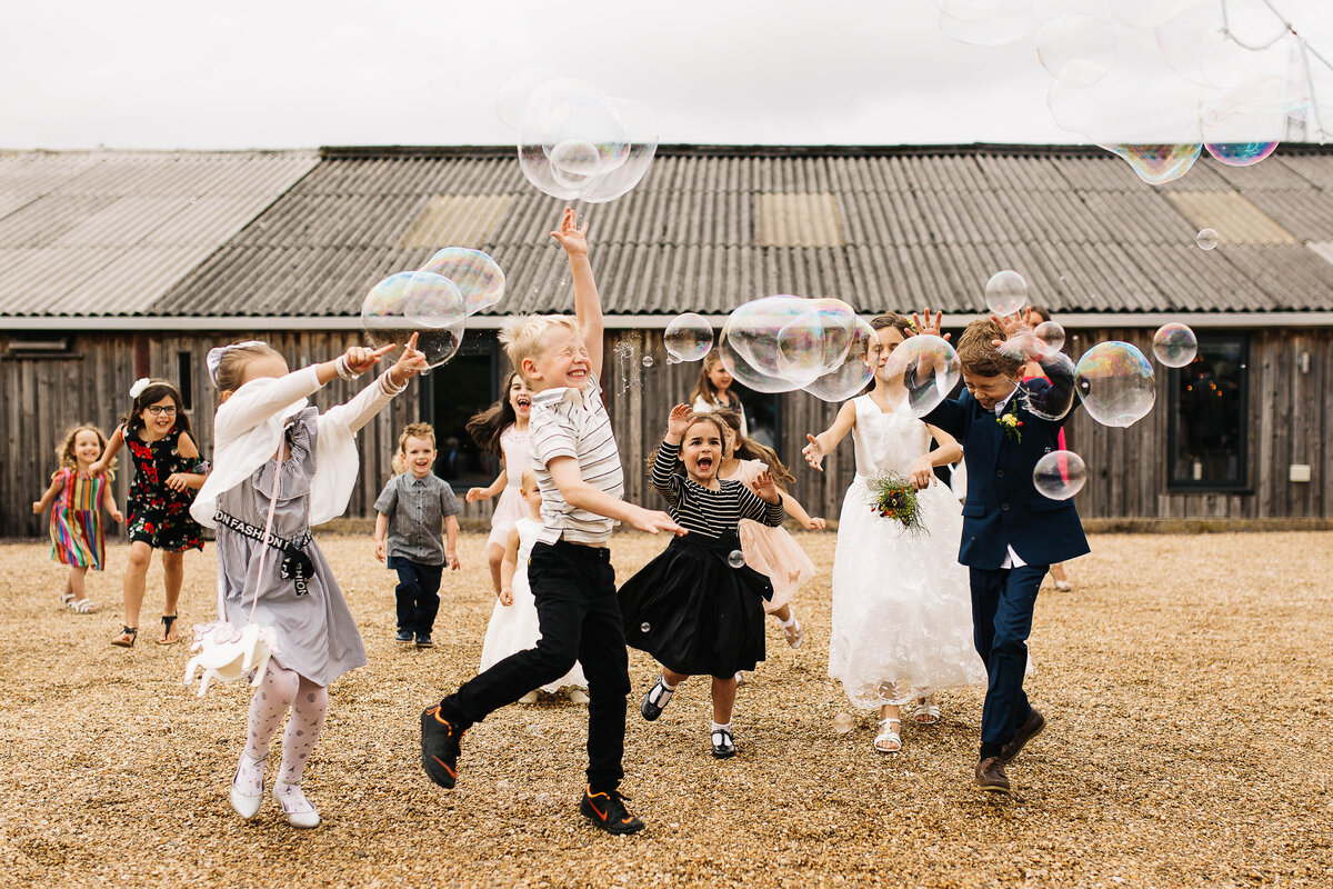 Children enjoying a bubbleologist at a wedding in Yorkshire