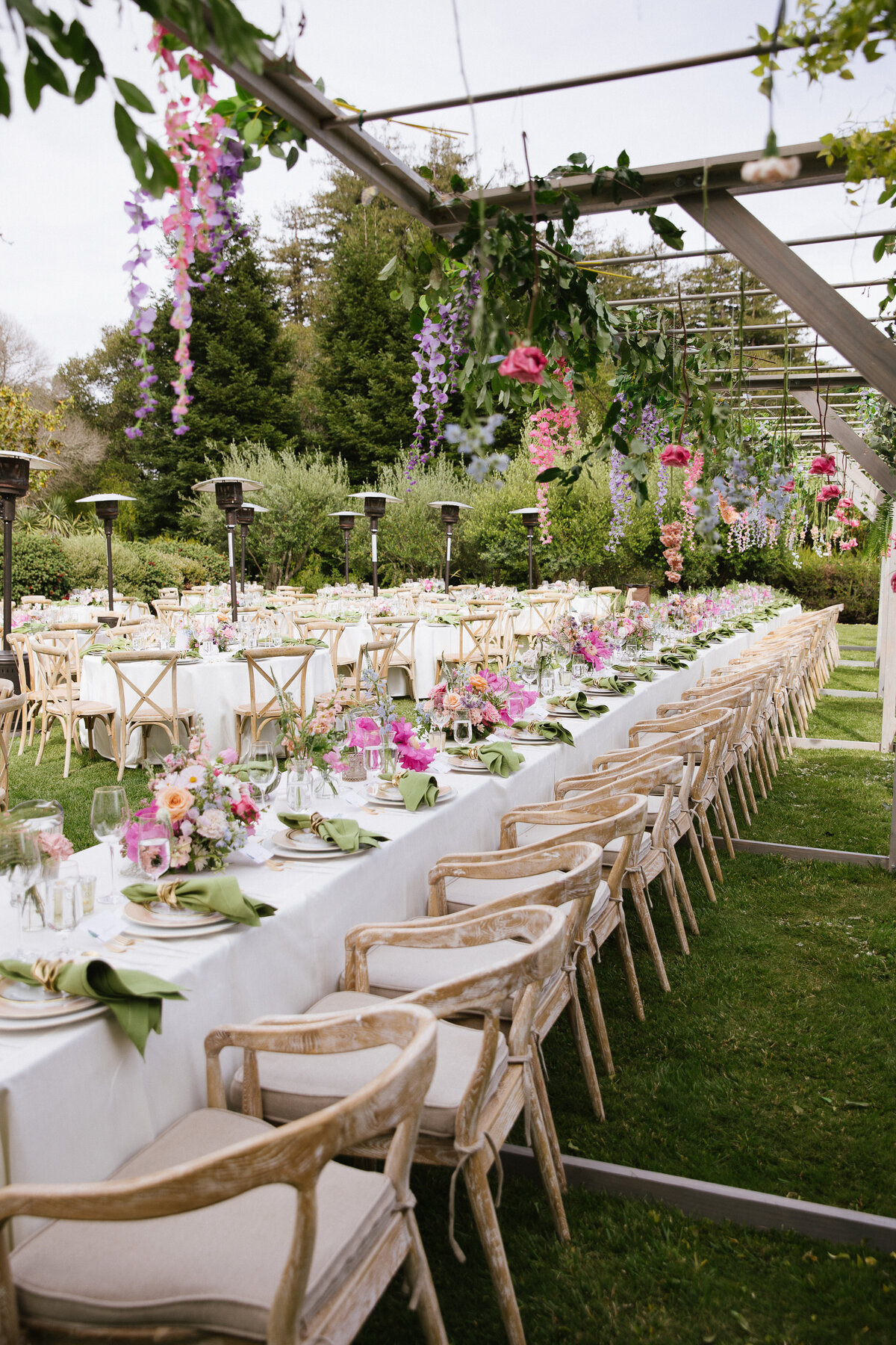Head Table with chairs and hanging colorful flowers at Kennolyn