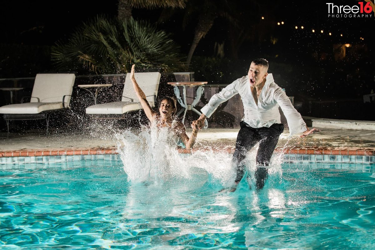 Bride and Groom jump in the pool during wedding reception at the Newhall Mansion in Piru, CA