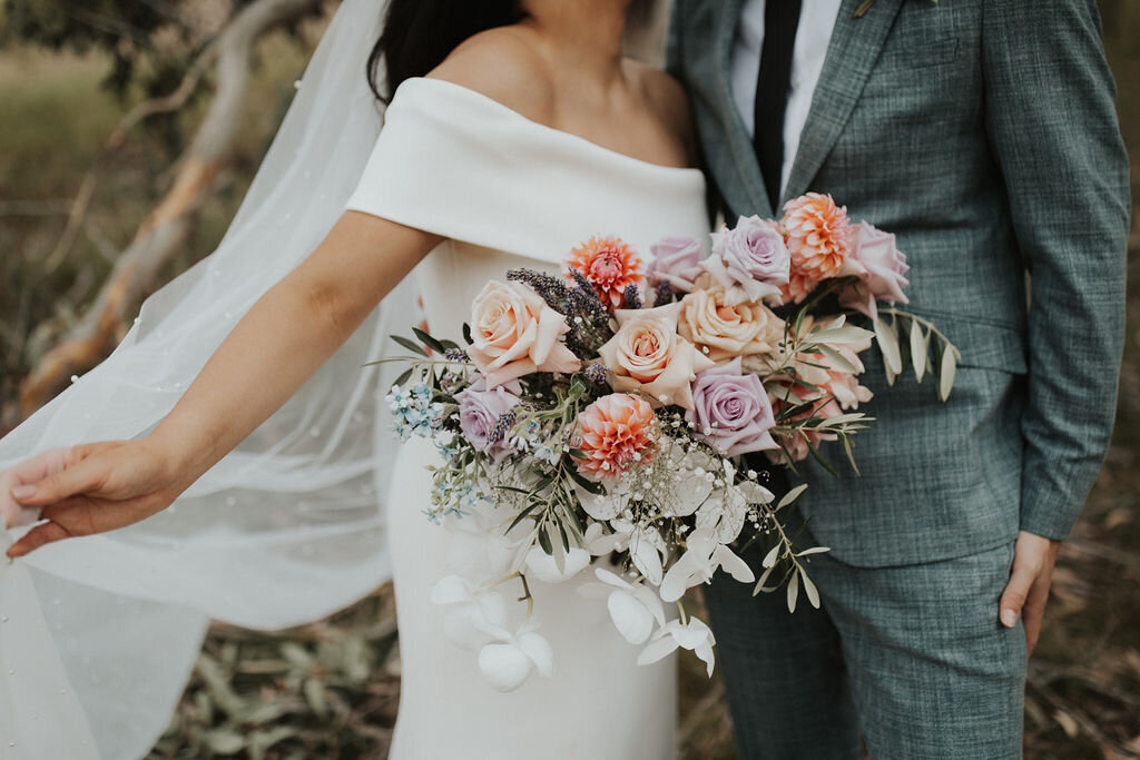 The Vase Floral Co - bride holds flower bouquet