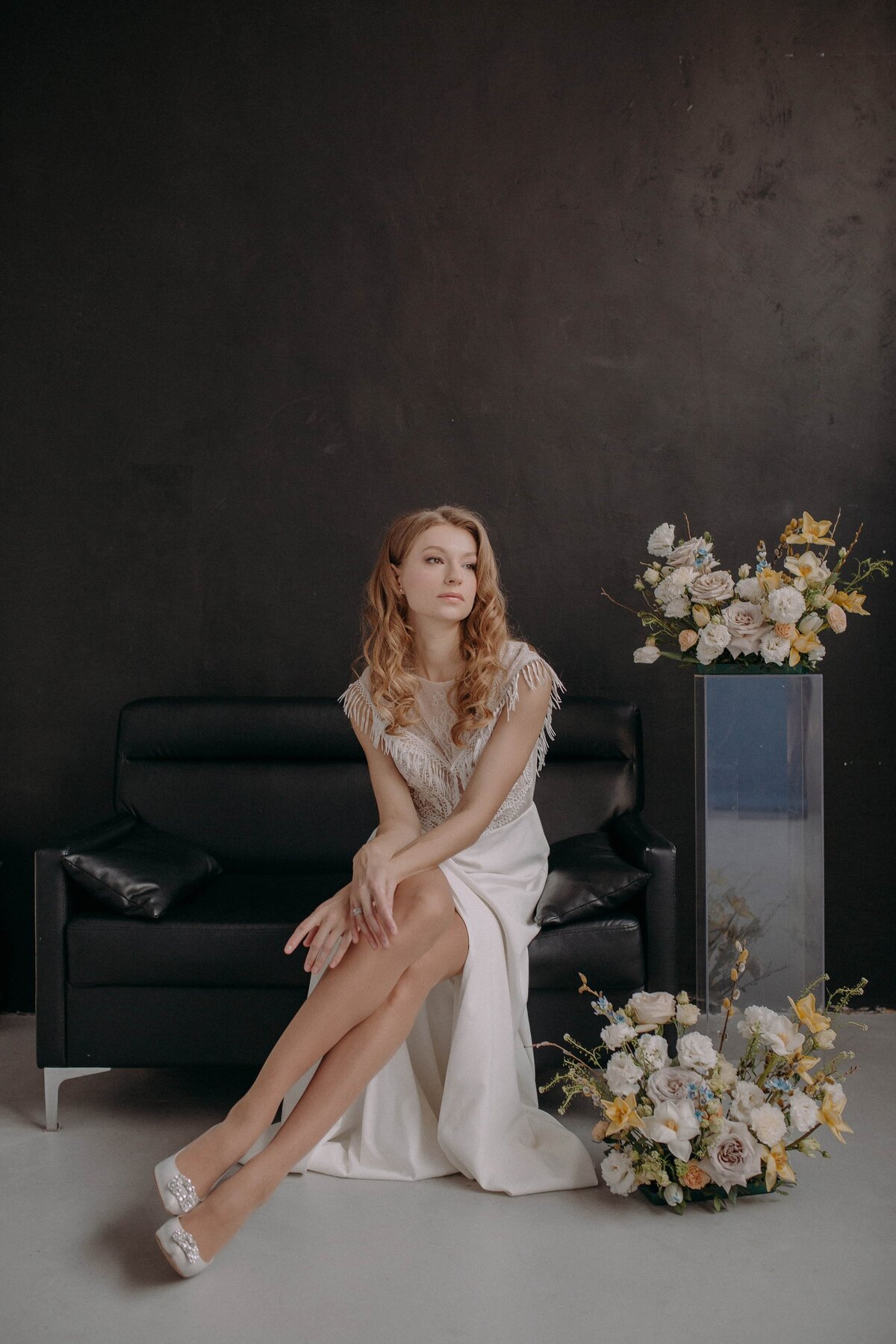 woman-in-white-dress-posing-with-flowers