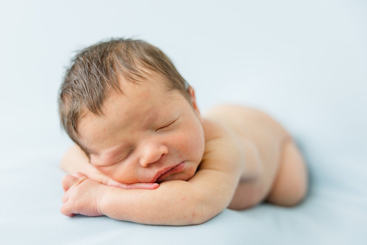 baby sleeping during newborn photo session in loveland, co