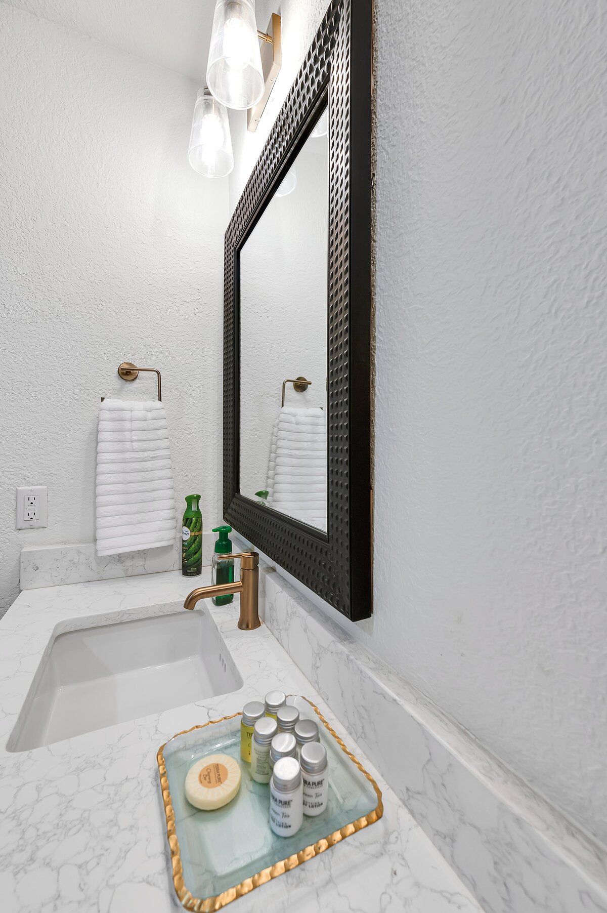 Bathroom vanity in this two-bedroom, two-bathroom vacation rental condo in the historic Behrens building in the heart of the Magnolia Silo District in downtown Waco, TX.