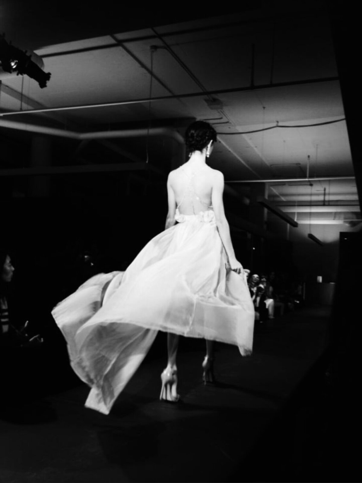 Woman walking down a fashion runway