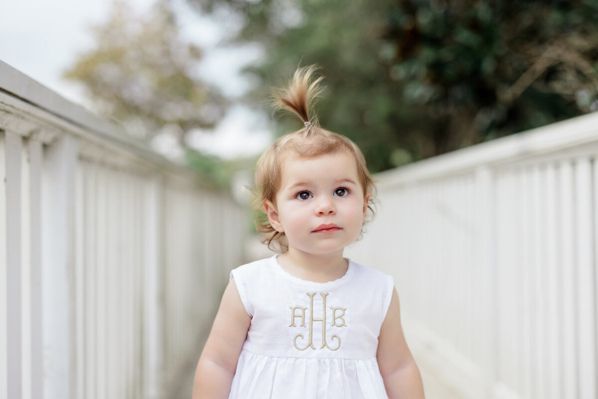 A small girl walking along a path