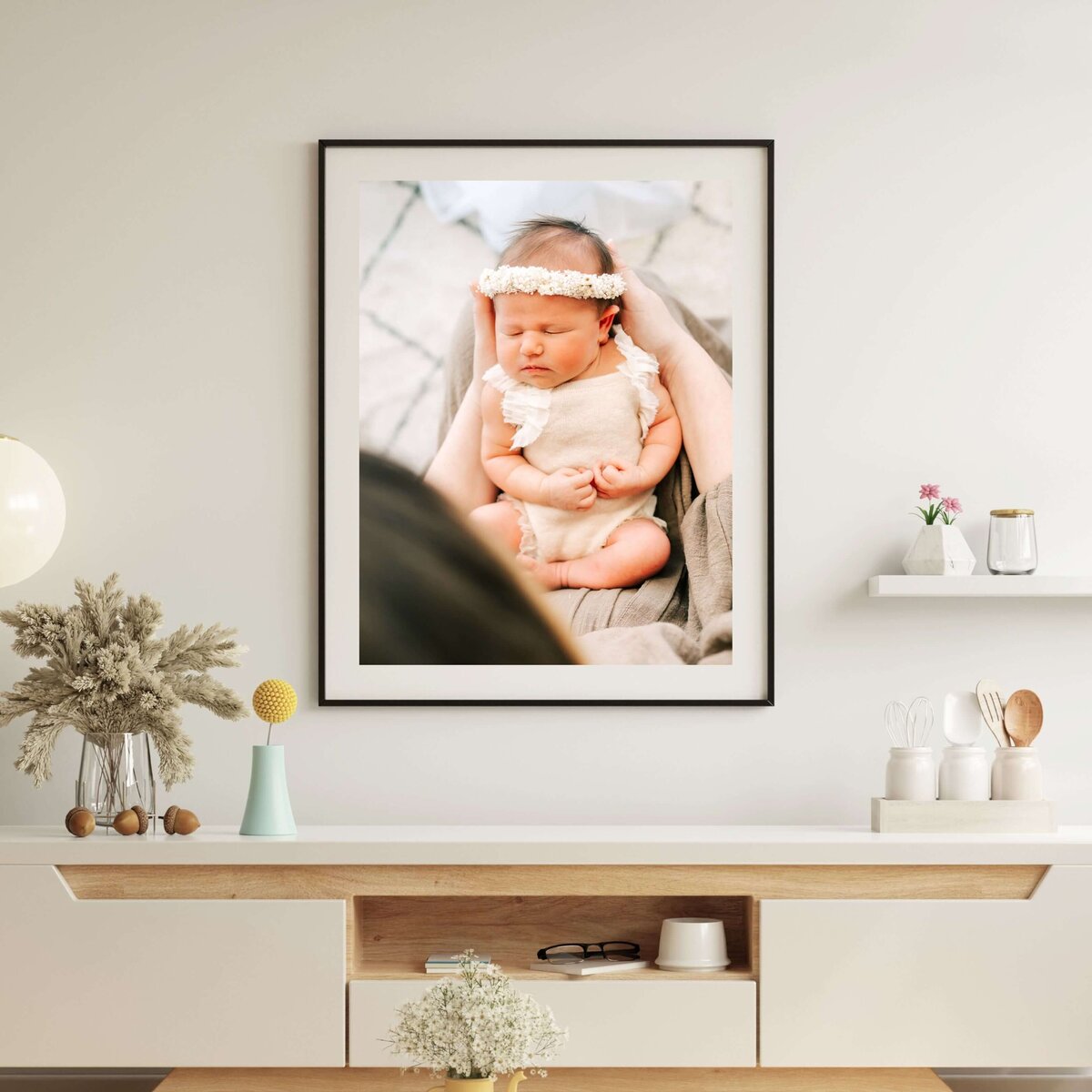 framed newborn photo of couple kissing while holding sleeping newborn by Springfield Mo newborn photographer Jessica Kennedy of The XO Photography