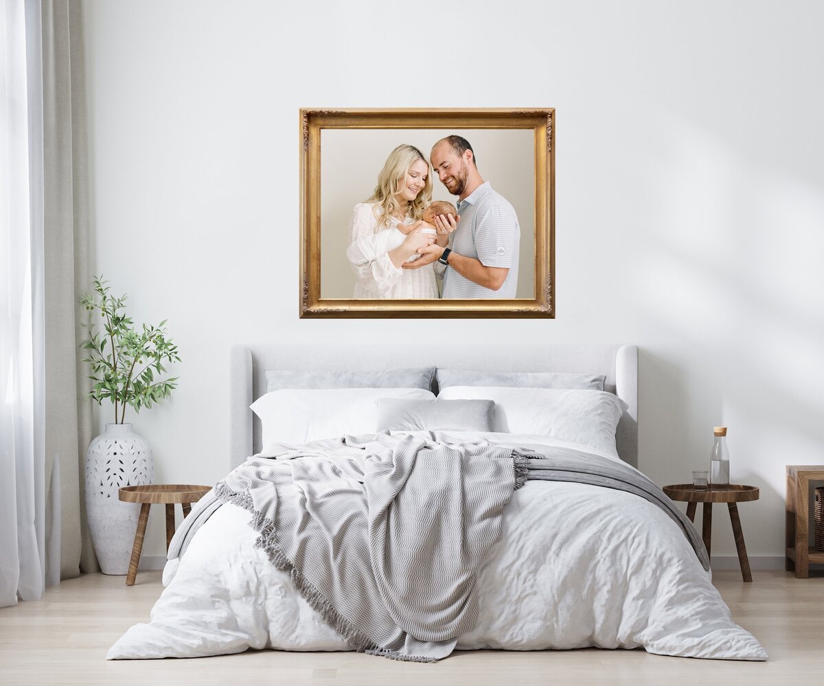 Gold frame canvas above a bed gallery wall ideas for your home by Raleigh family photographer A.J. Dunlap Photography.
