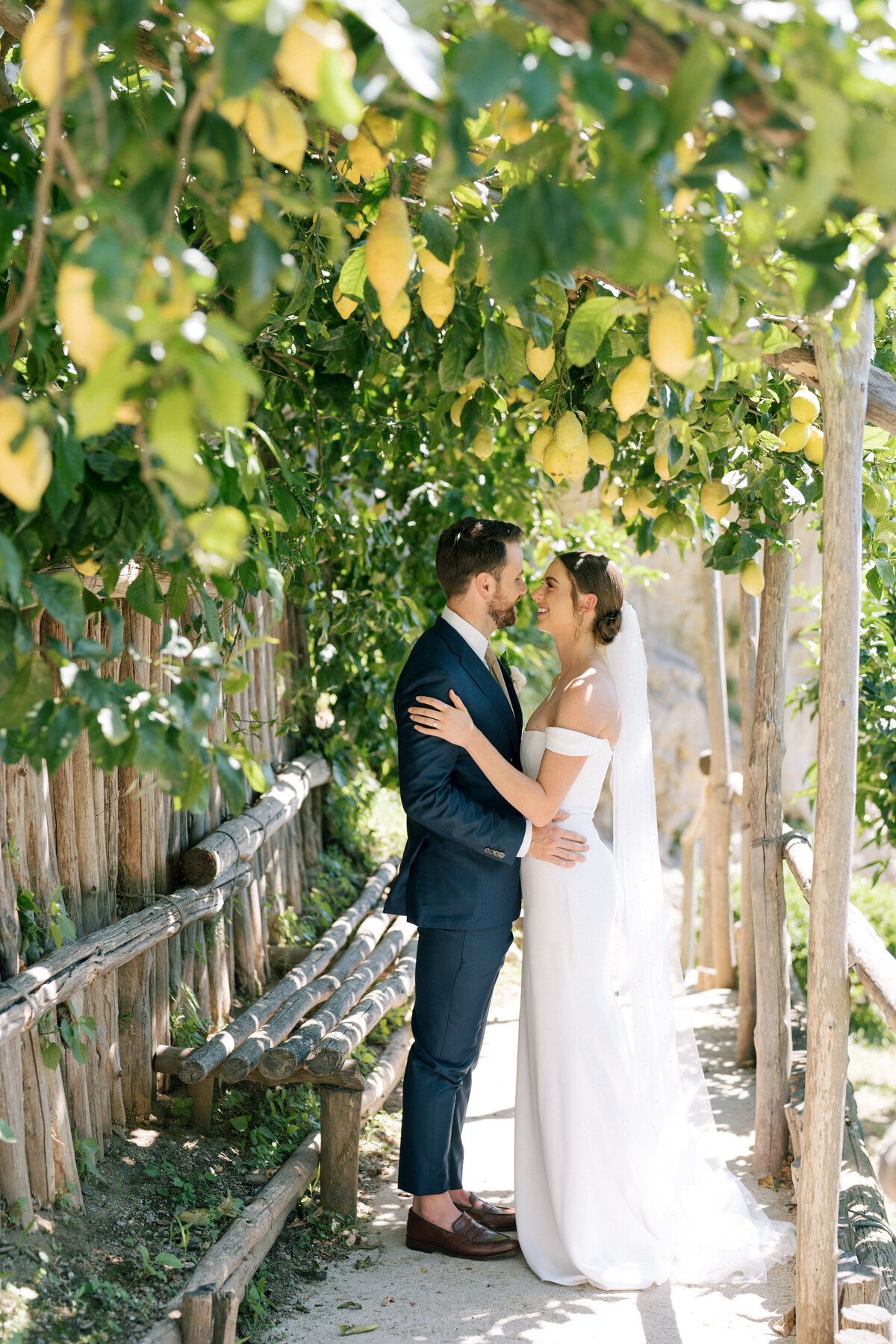 Bride and groom in lemon groves in Positano
