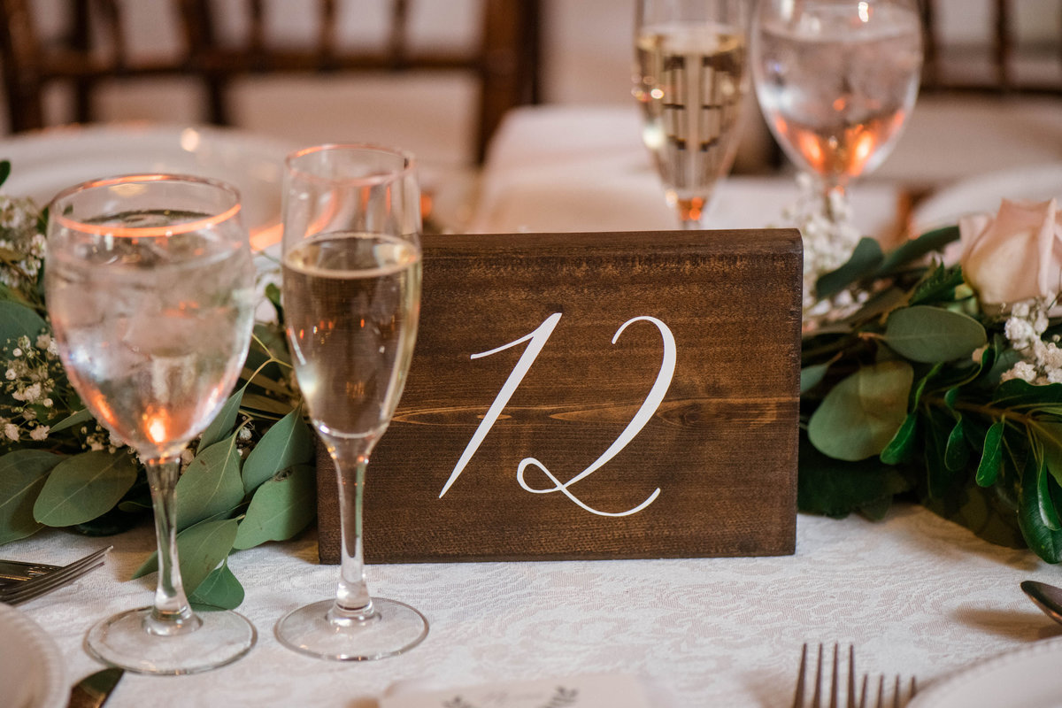 wedding photo of table number and setting from wedding at the Mansion at Timber Point