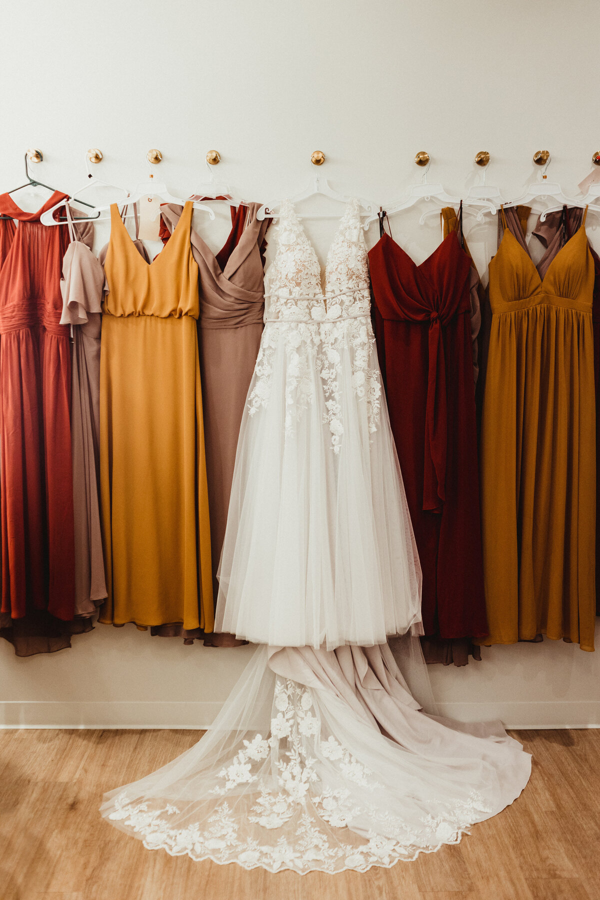 wedding gown and wedding party dresses hanging up