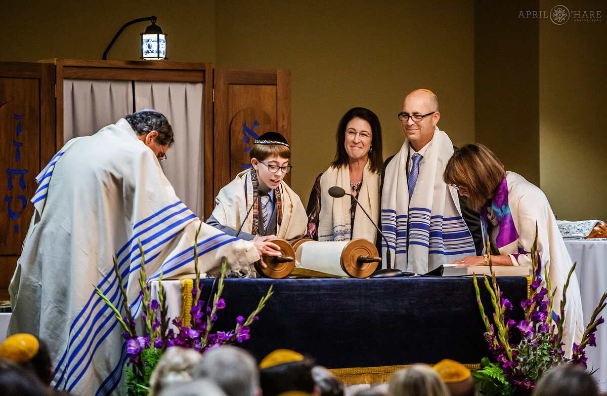 Proud Parents Look on as their Son Reads from the Torah at his Bar Mitzvah Service in Fort Collins Colorado