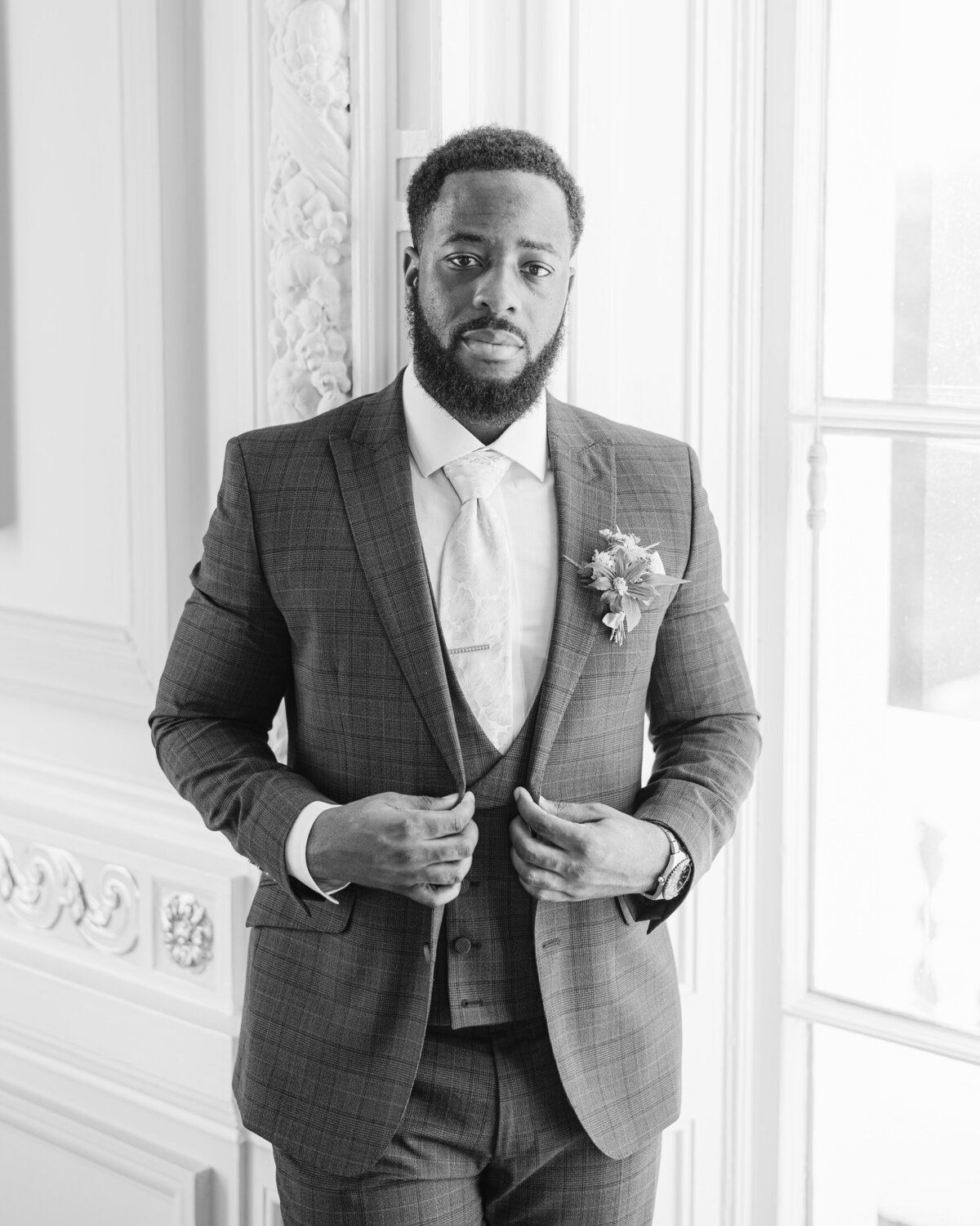 Black and white portrait and groom at 10-11 Carlton House Terrace wedding venue in London