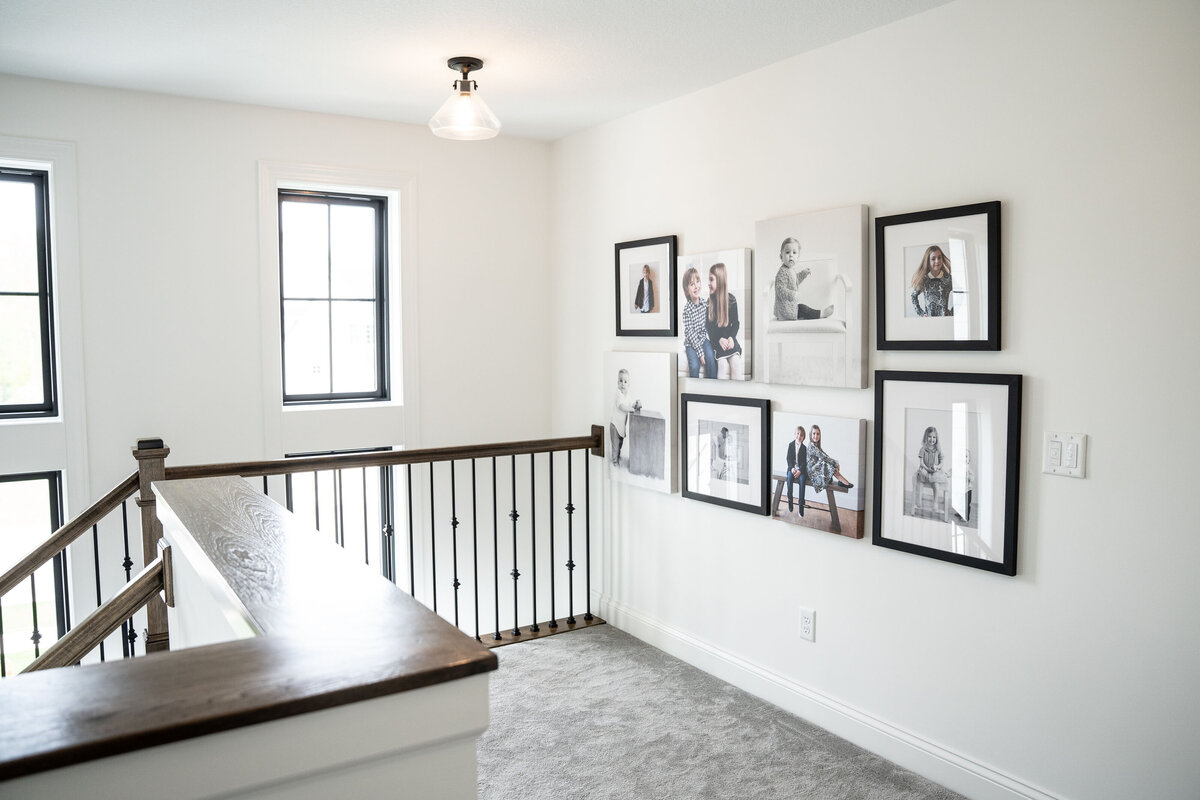 frame-collection-at-top-of-stairs