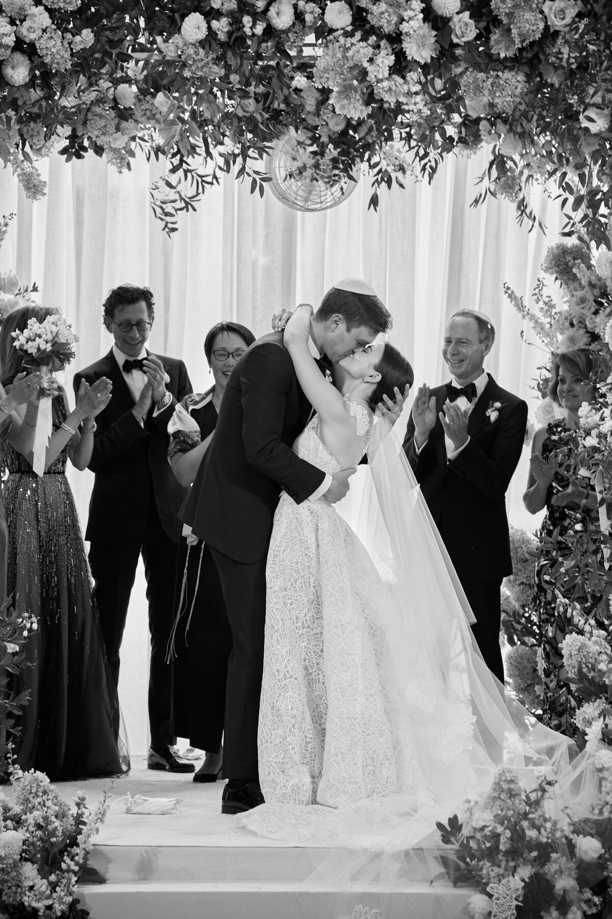 wedding couple first kiss as husband and wife