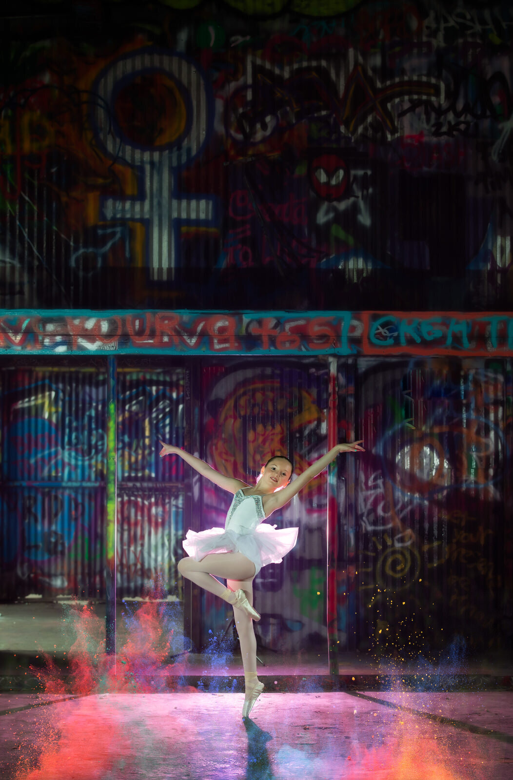 ballerina-posing-in-graffiti-yard-with-paint