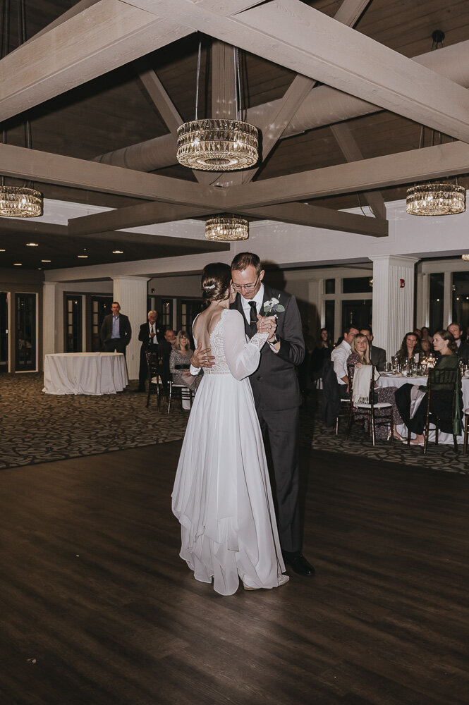 bride and groom dancing together at wedding reception
