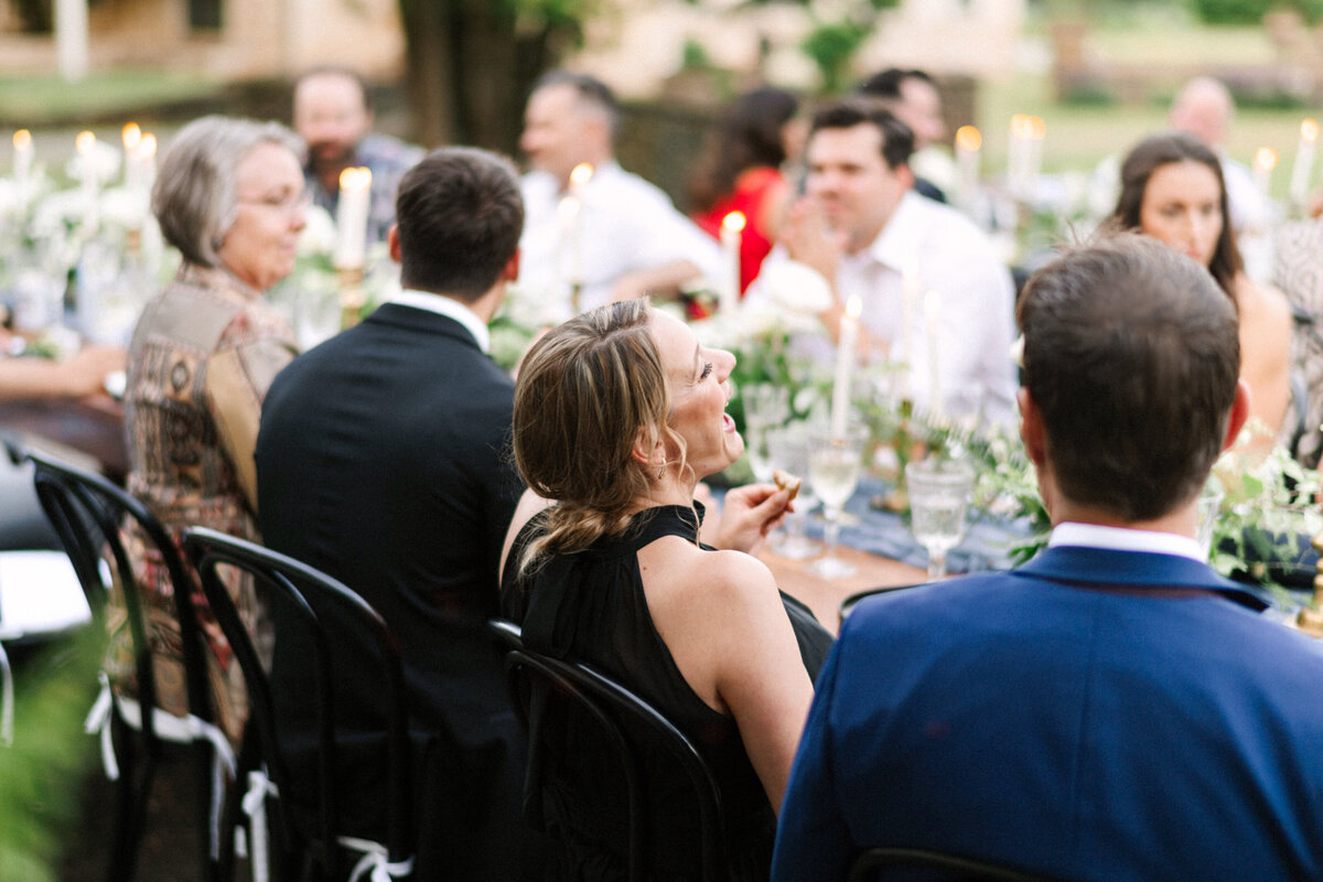 wedding guest enjoying conversation at table