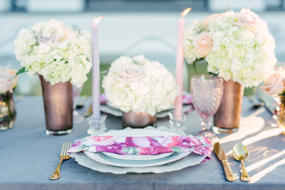 purple floral centerpiece and place setting
