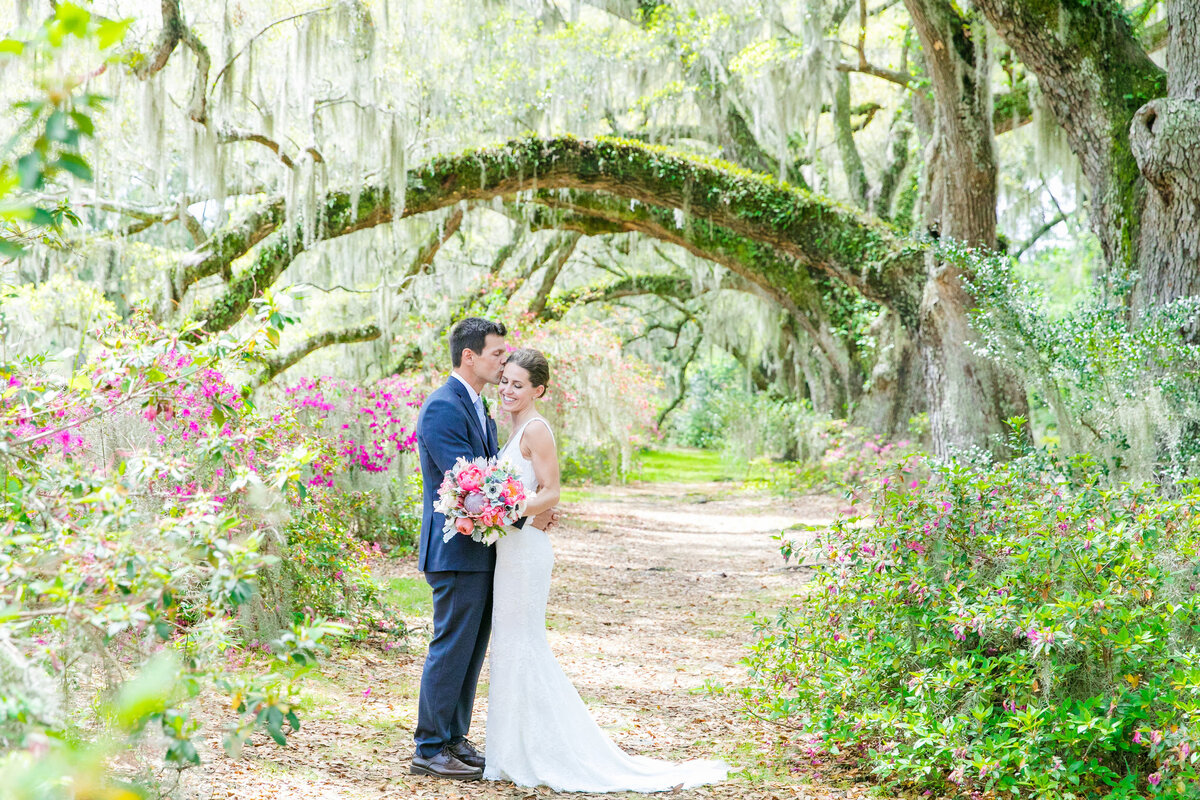 bride + groom at their magnolia plantation wedding
