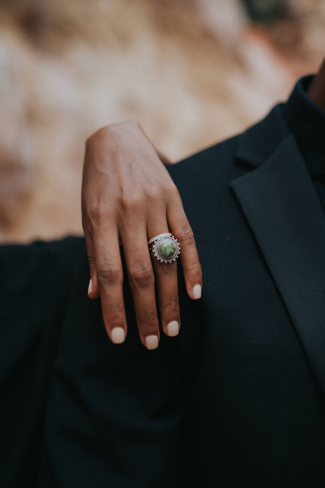 Black woman's hand with large ring