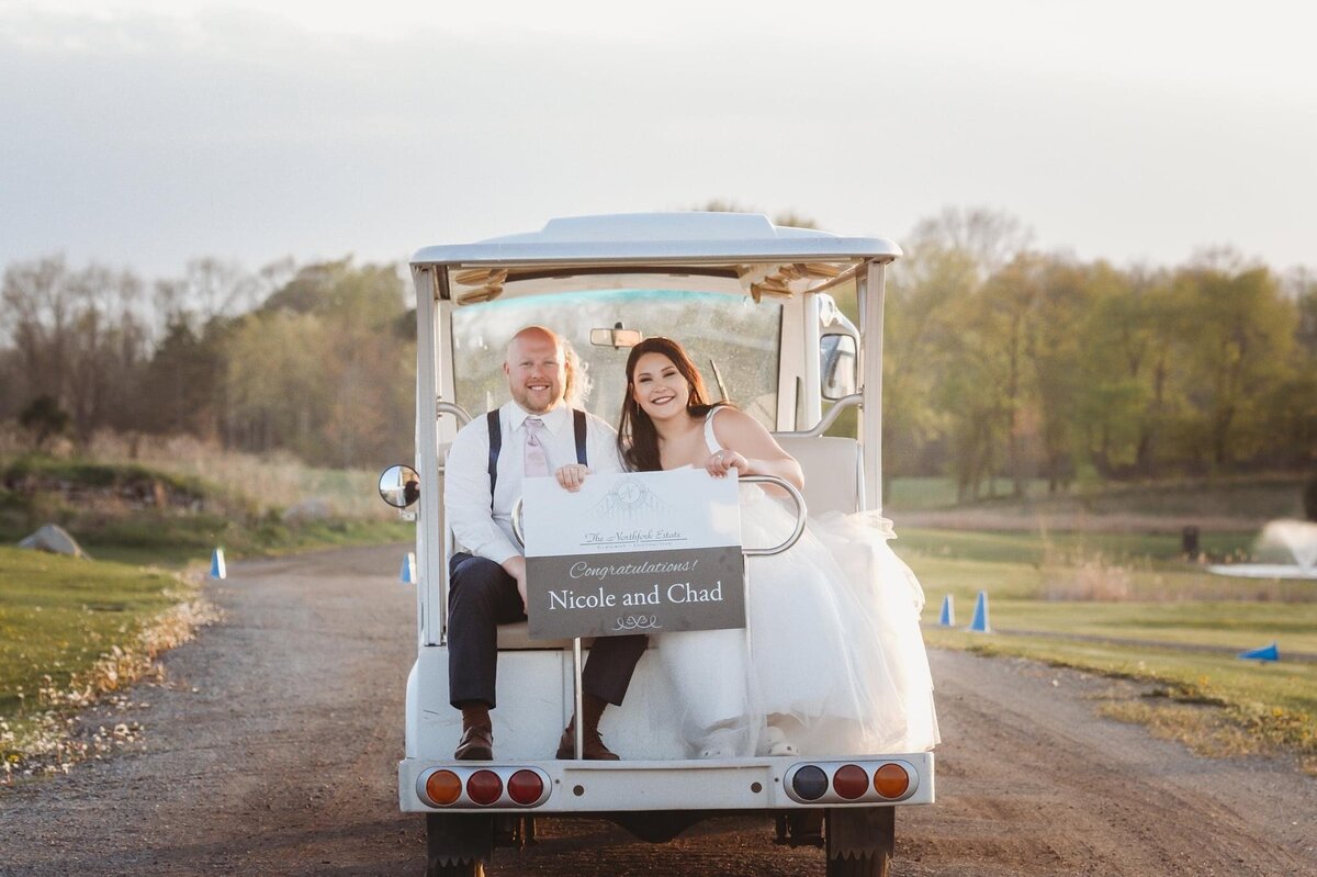 couple on golf cart