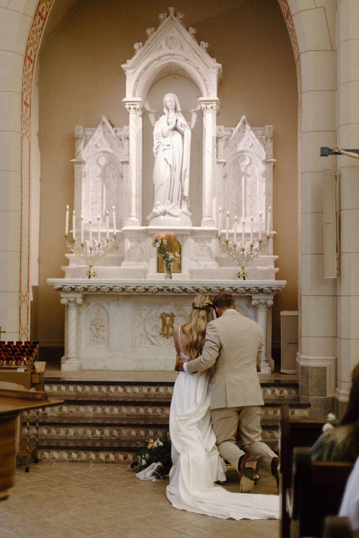 bride and groom praying together