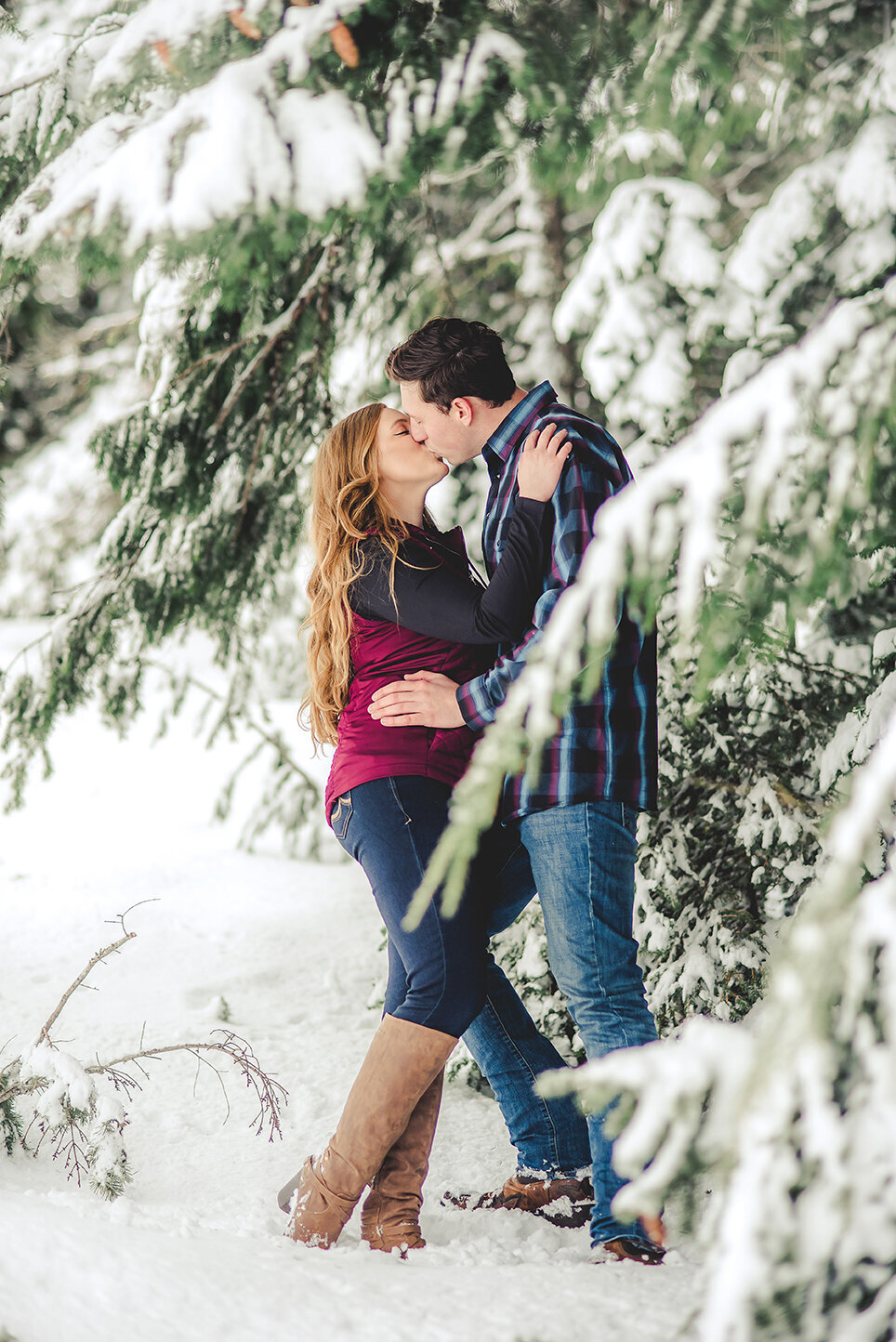 couple kissing in snow