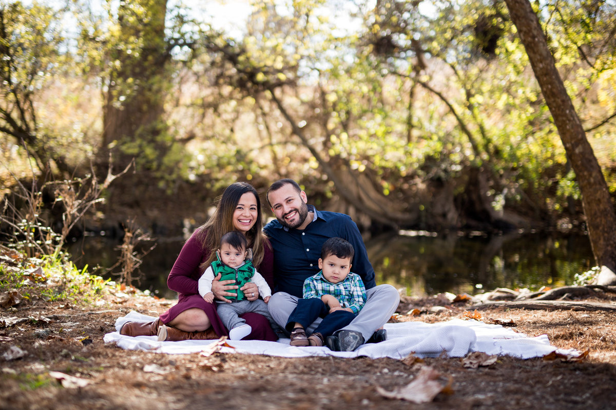 family portrait on river bank by San Antonio Photographer Expose The Heart photography