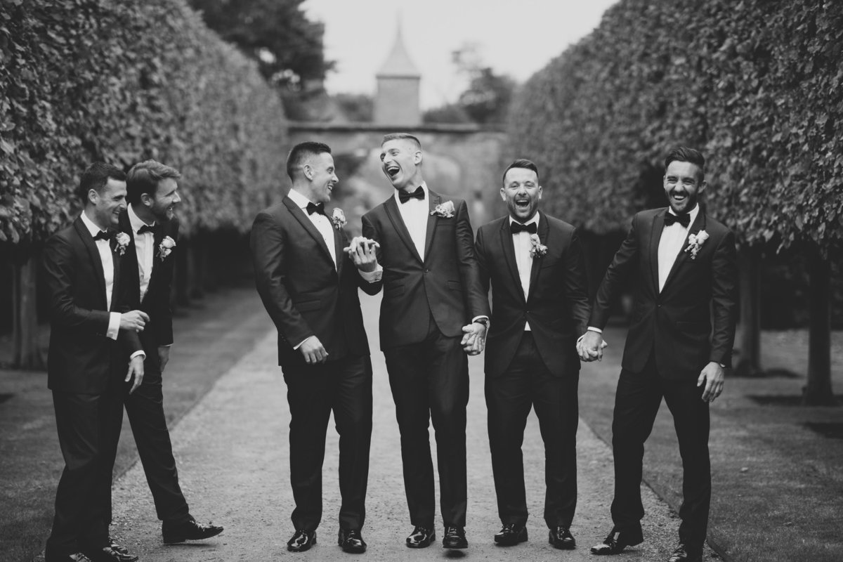 groomsmen laughing hands