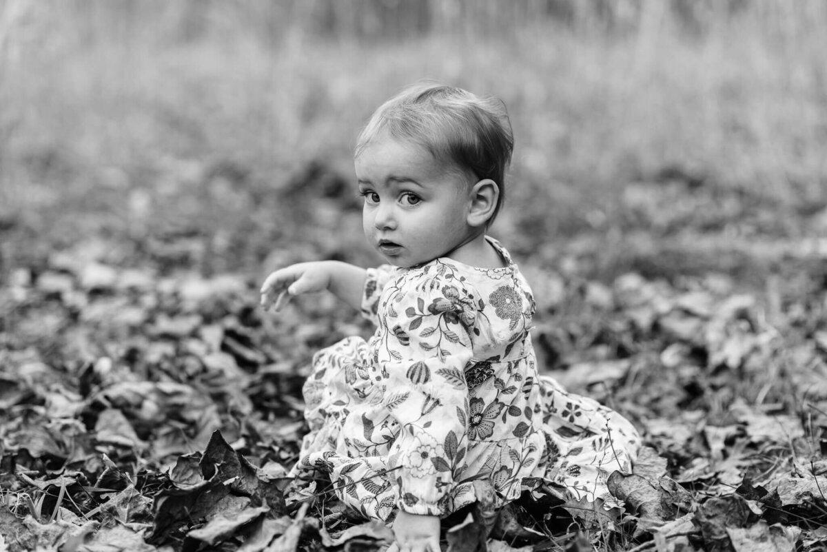 A candid B&W moment of a young child captured by Northern Virginia family photographer, Denise Van