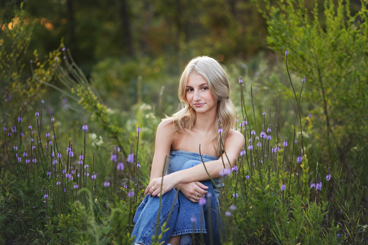 blond girl in field of purple flowers