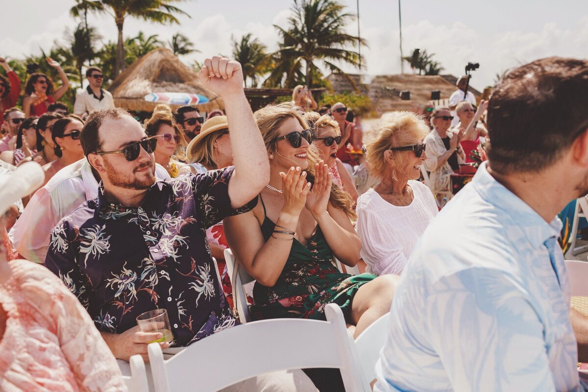 Guests clapping at wedding ceremony in Cancun