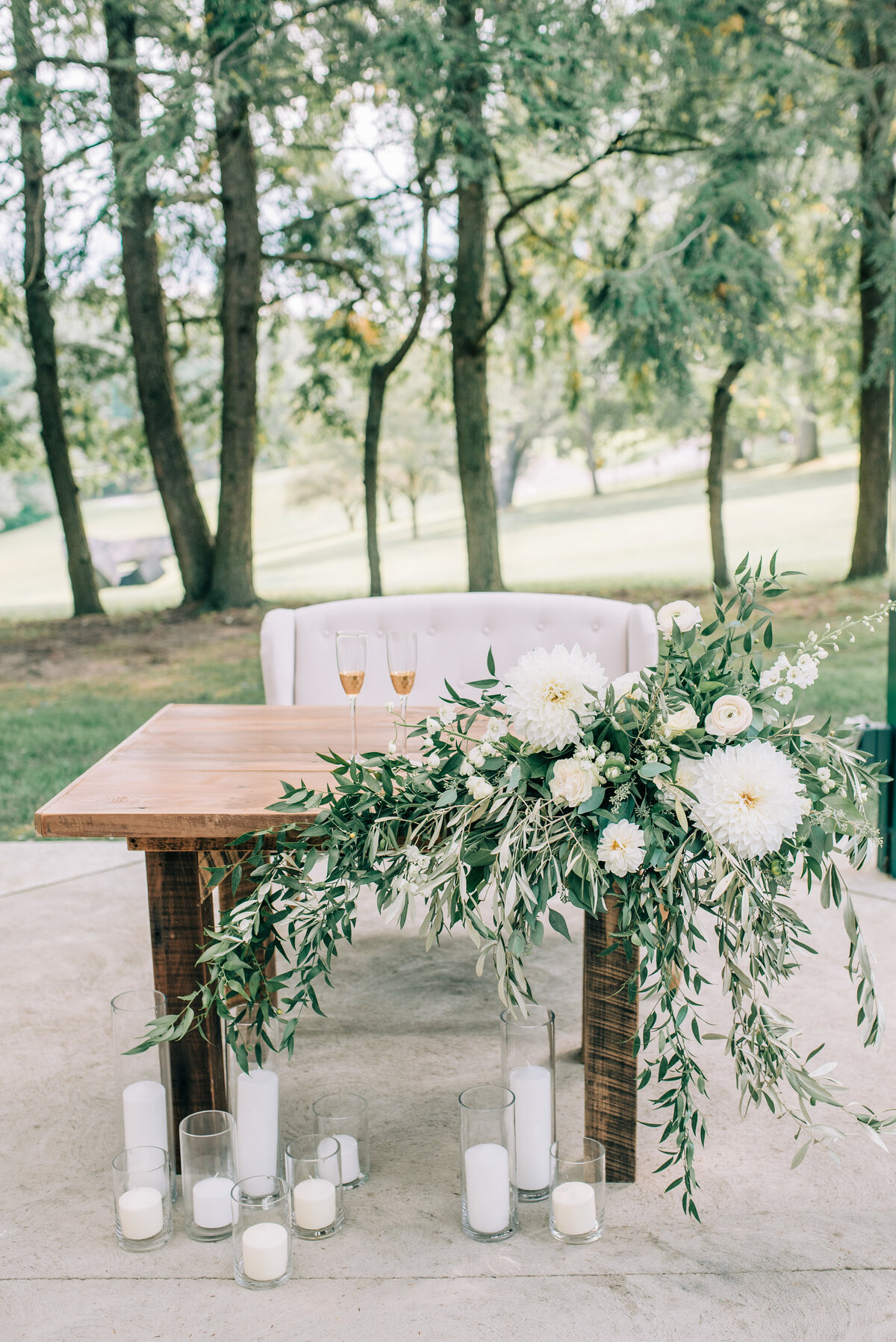 farmers daughter's floral installment at sweetheart table- hartwood acres estate