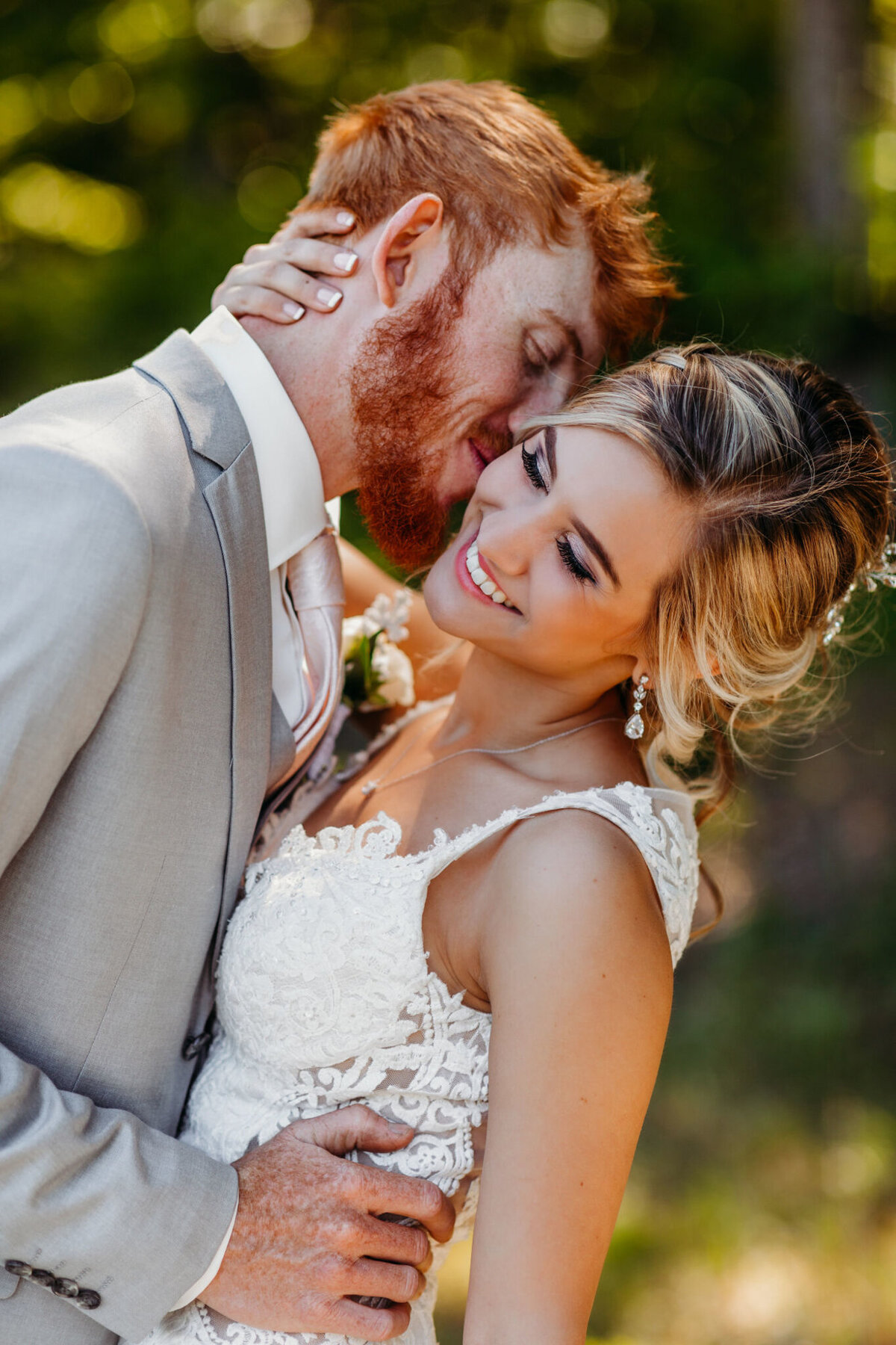 photo of Allie being kissed on the cheek on her wedding day