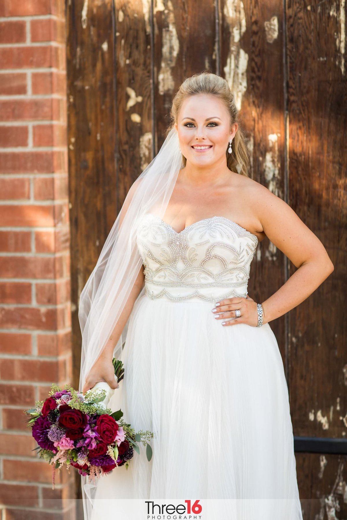 Bride smiles for the camera prior to her wedding ceremony