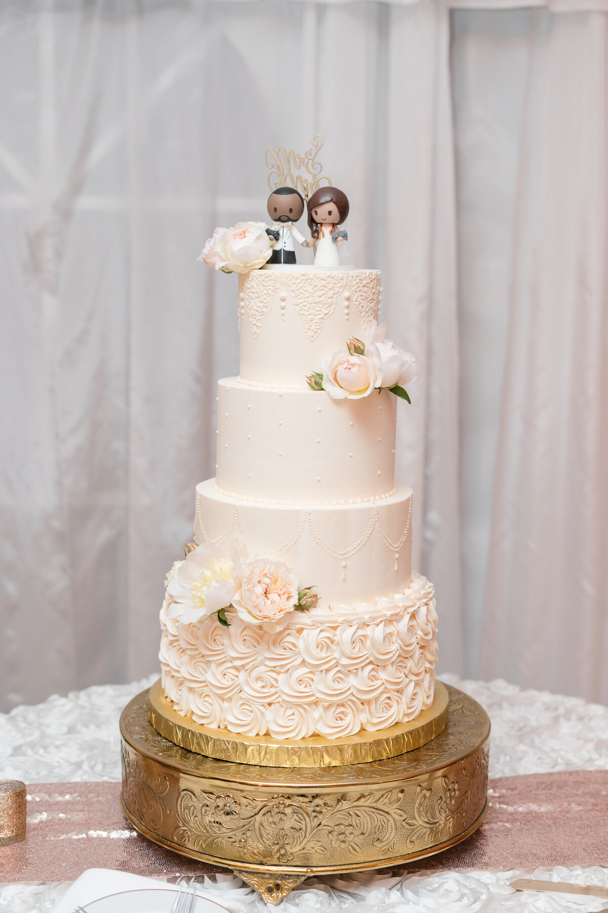 three tired buttercream cake with cake topper