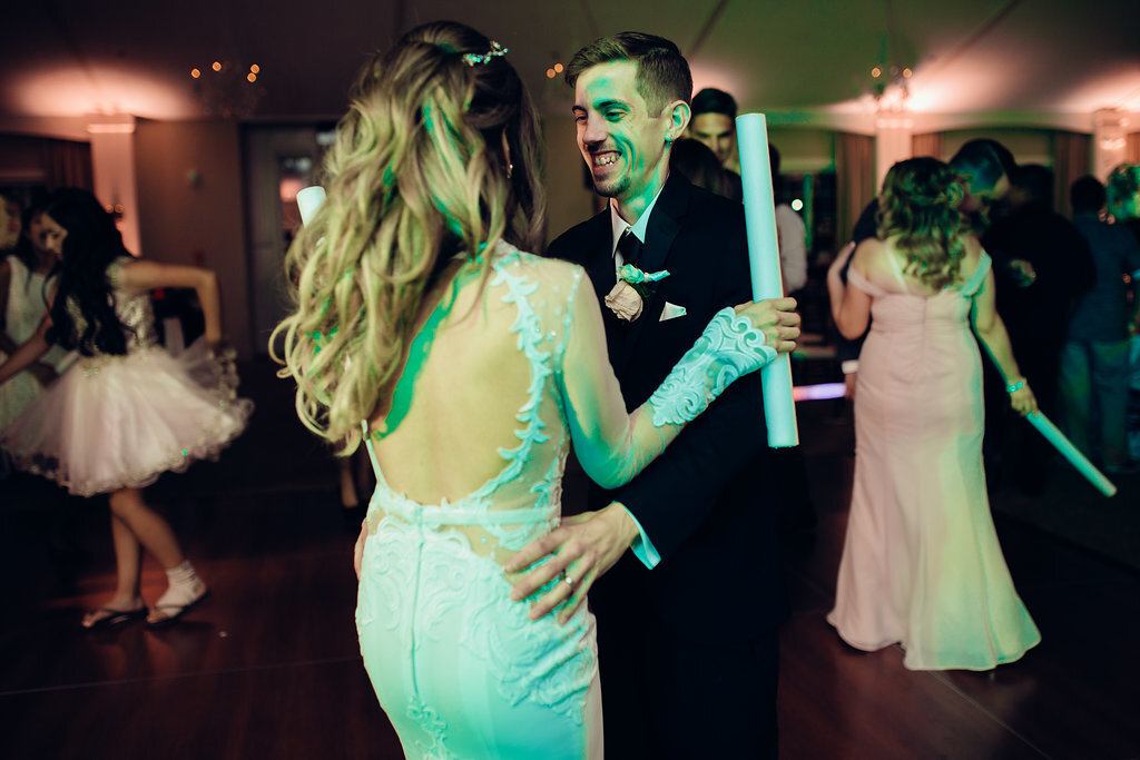 Wedding Photograph Of Bride And Groom Laughing While Dancing Los Angeles